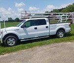 Ford F-150 with attachment in truck bed