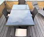 1 outdoor dining table + 4 chairs. 1 outdoor sofa (made of 3 single units). 1 large rounded chair
