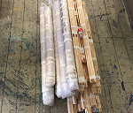 Rolls of paintings and wood strechers